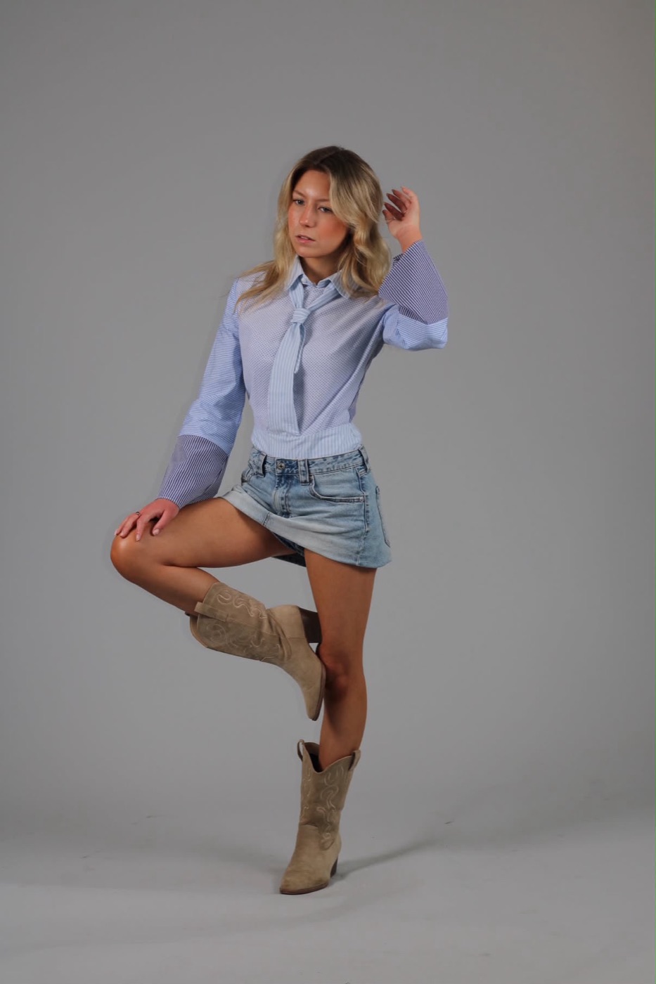 The finished shirt worn with a denim mini and suede cowboy boots